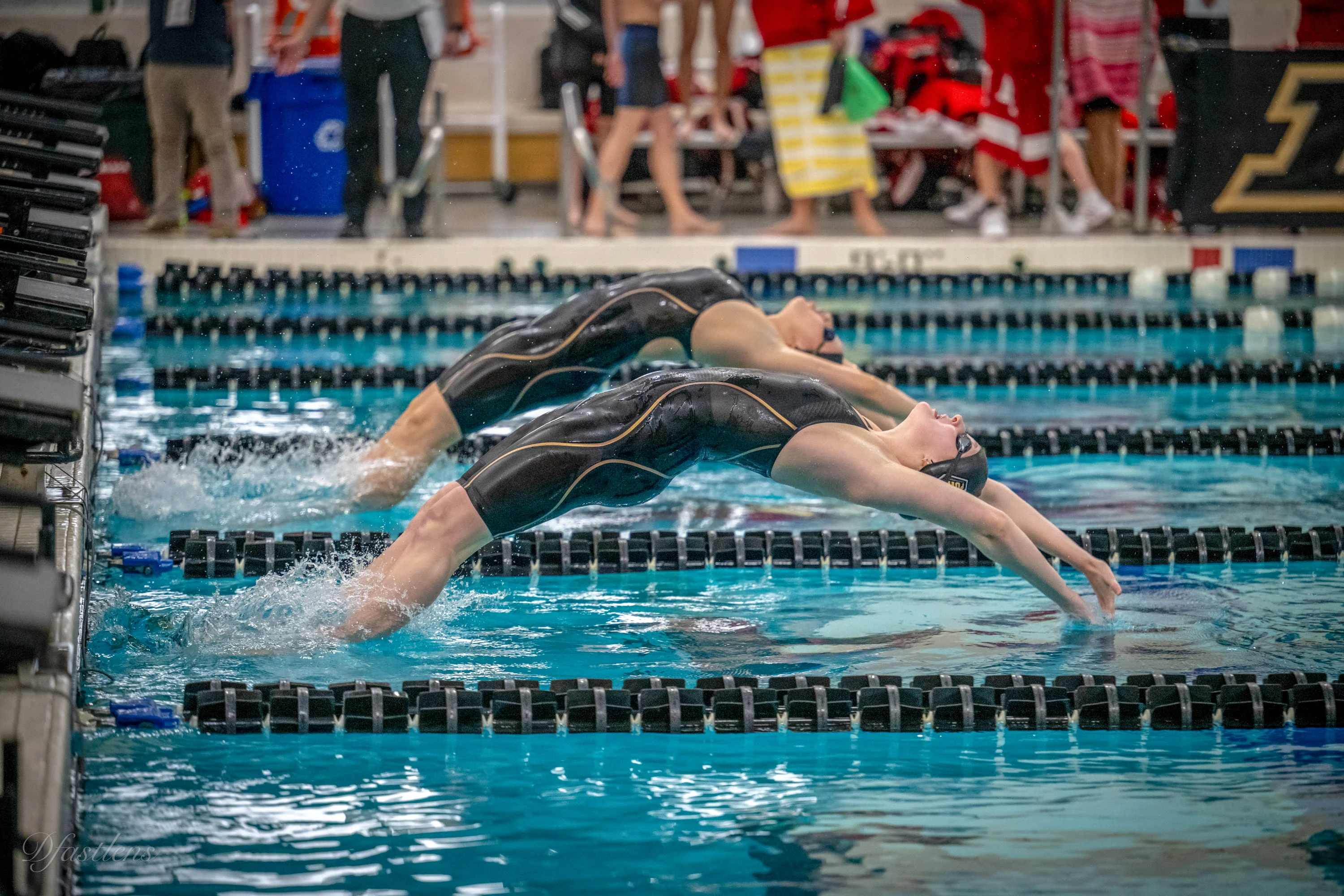 Grace Ackerman swimming backstroke in competition