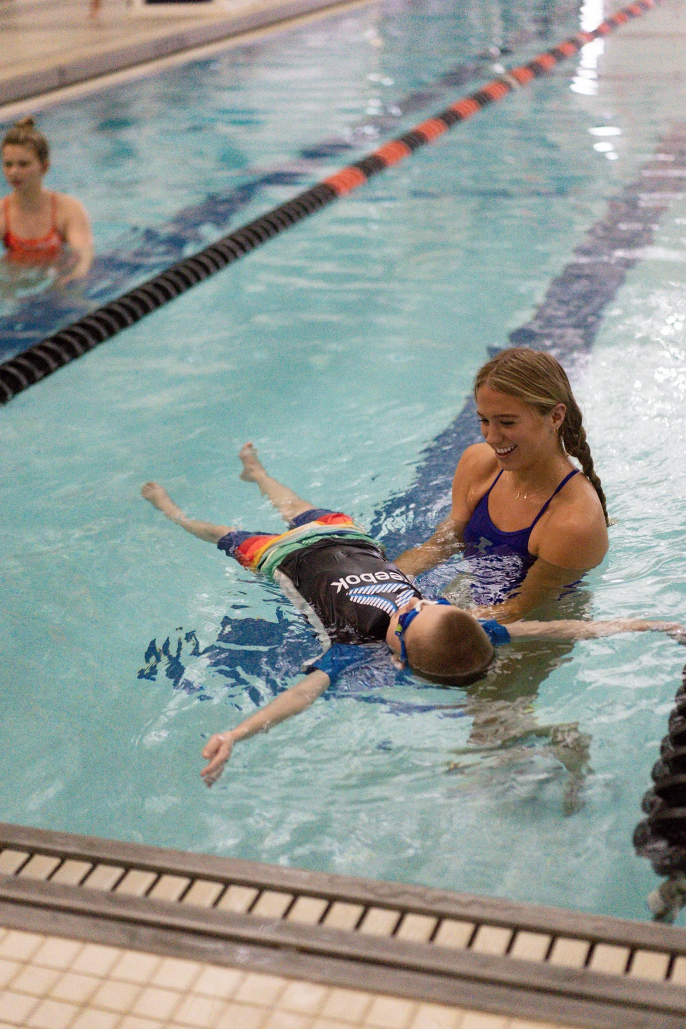 Young swimmer learning to float